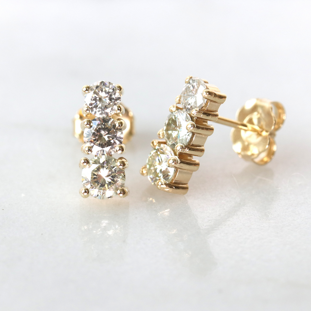 three-stone graduated diamond earrings